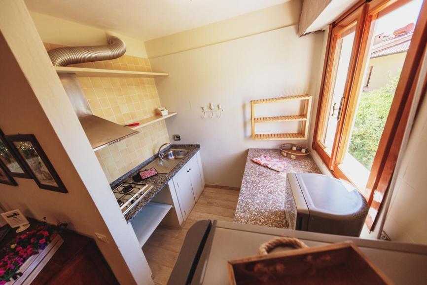 Kuchyň nebo kuchyňský kout v ubytování Residence il Mandorlo