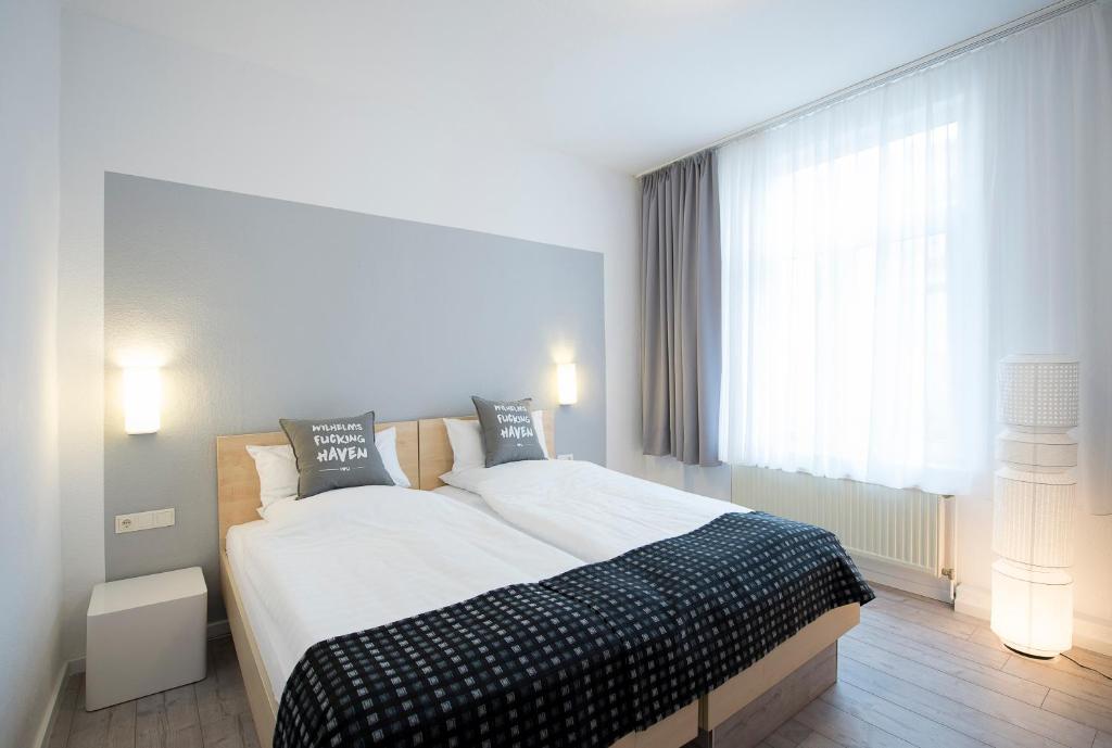 Postel nebo postele na pokoji v ubytování Hotel Keil