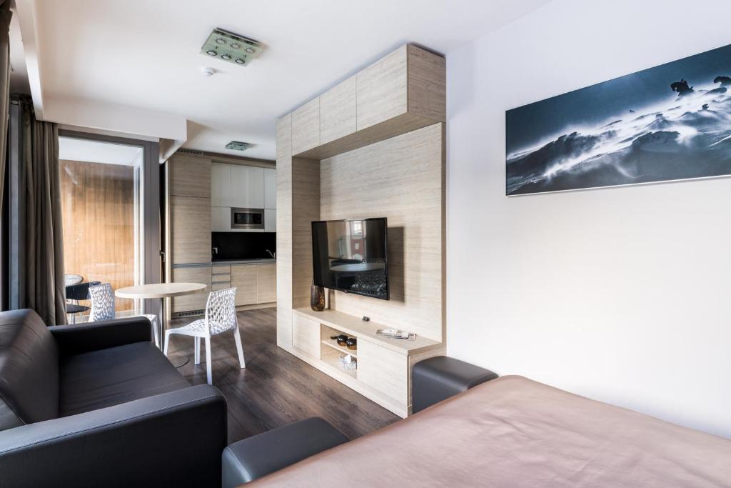 TV a/nebo společenská místnost v ubytování HOTEL PECR WELL