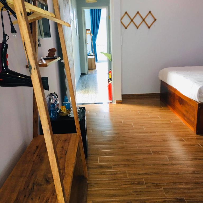 Postel nebo postele na pokoji v ubytování An Bang Sea Adventure Homestay Hoi An