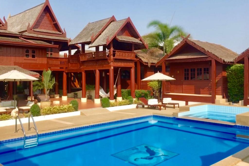 a villa with a swimming pool and a resort at Danieli Resort in Hua Hin