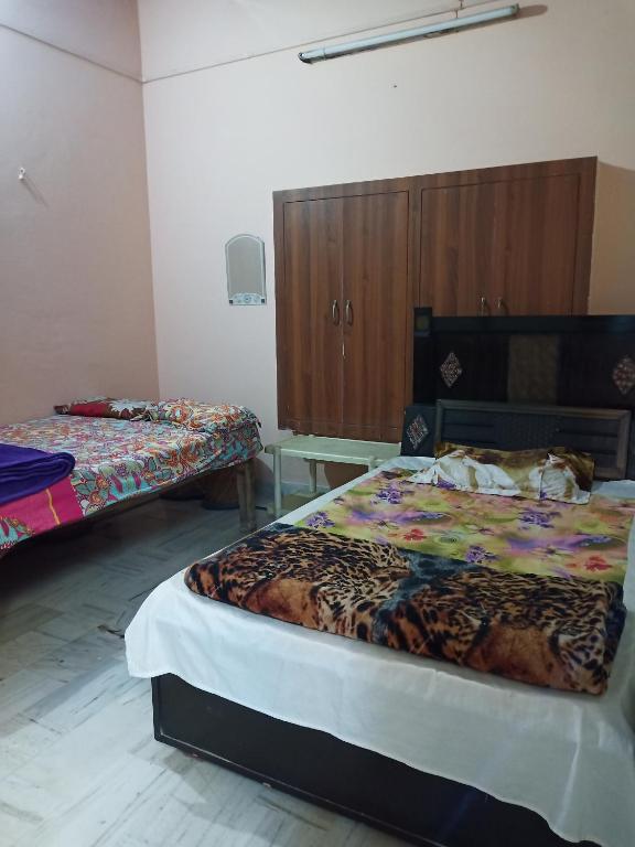 Postel nebo postele na pokoji v ubytování Sunita homestay