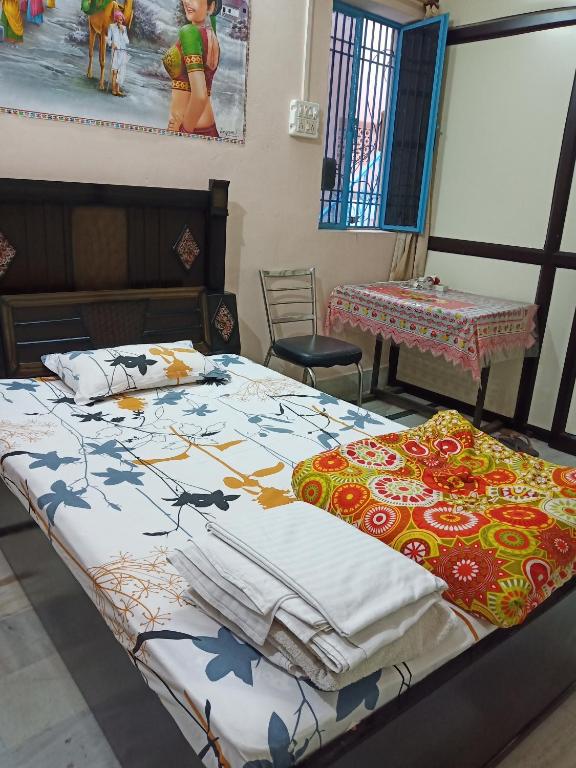Postel nebo postele na pokoji v ubytování Sunita homestay