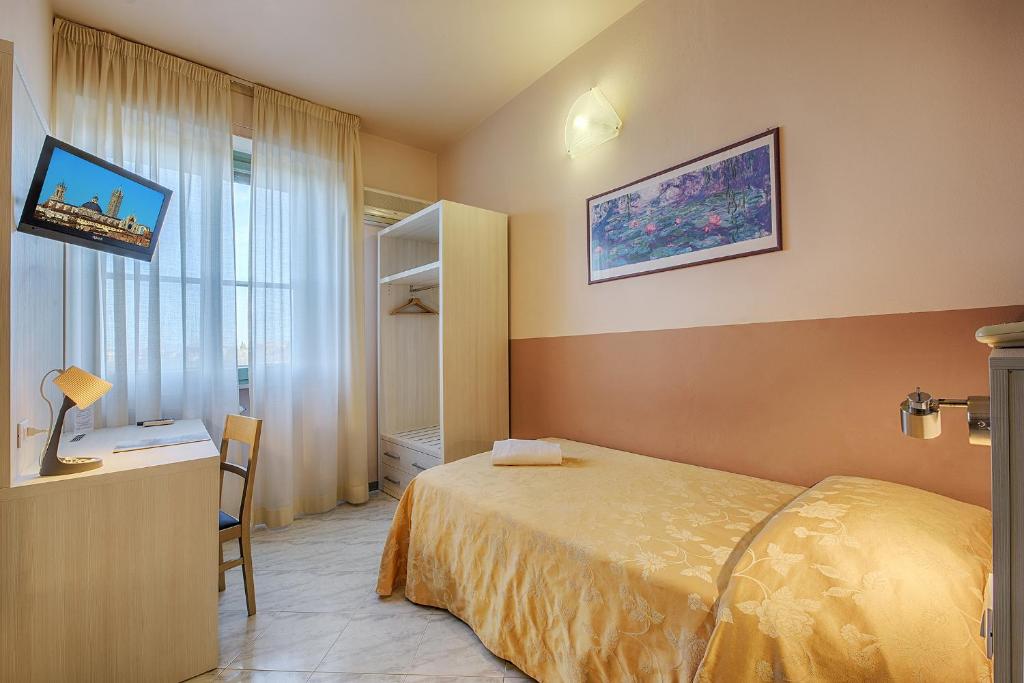 Postel nebo postele na pokoji v ubytování Hotel Castello