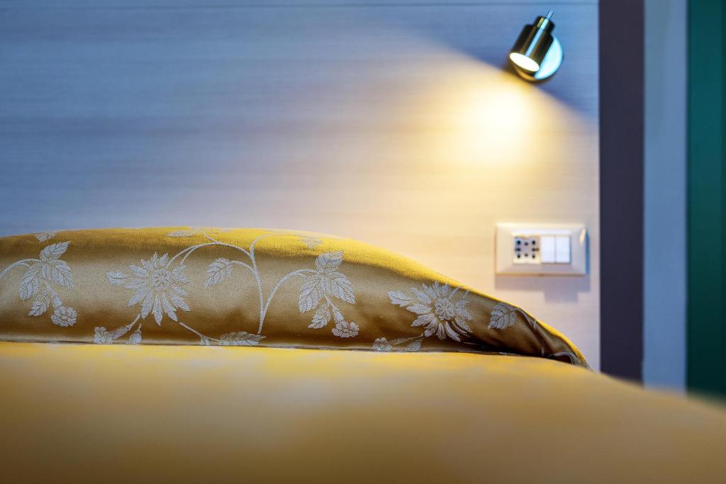 Postel nebo postele na pokoji v ubytování Hotel Castello