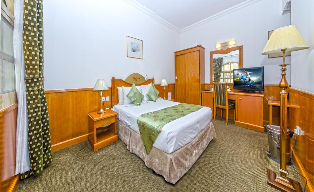 Postel nebo postele na pokoji v ubytování Zain International Hotel