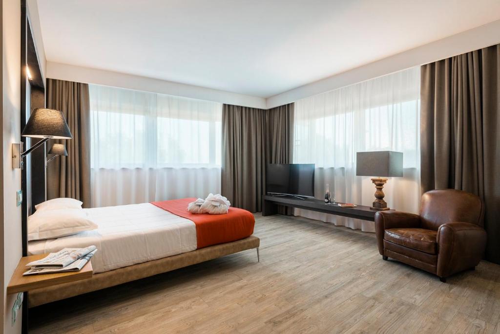 Кровать или кровати в номере Hotel Dimorae Rooms and Suites - Apartments
