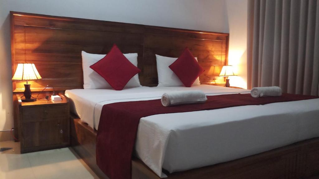 Postel nebo postele na pokoji v ubytování Shani Residence Kandy