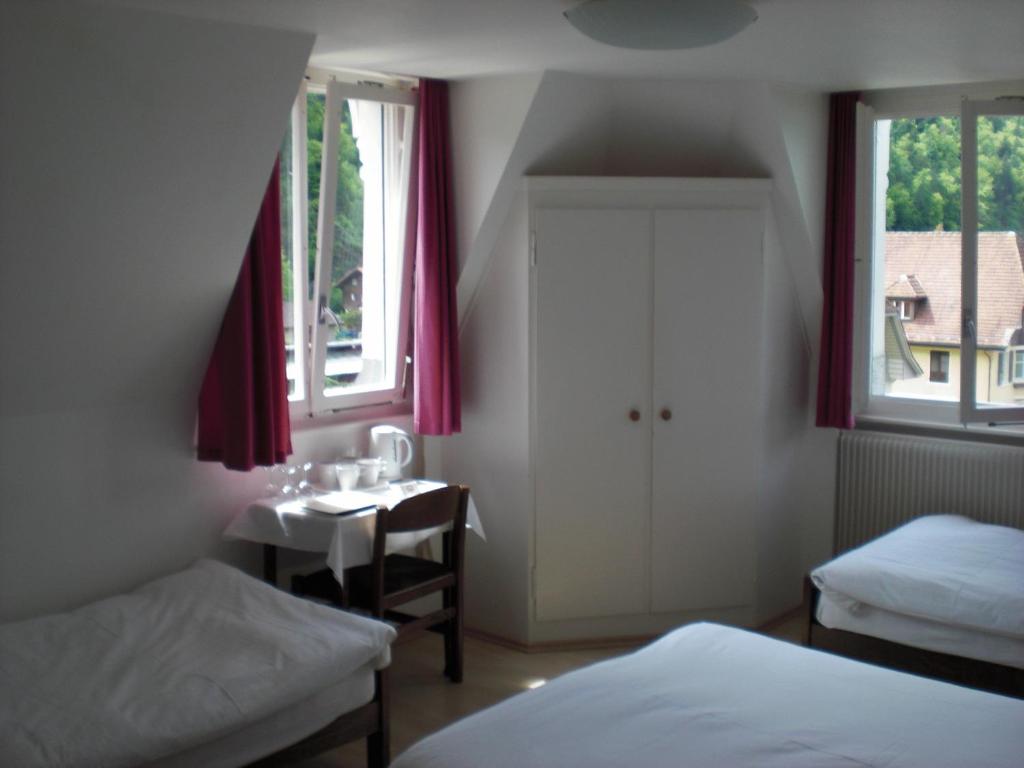 Postel nebo postele na pokoji v ubytování Hotel De La Paix