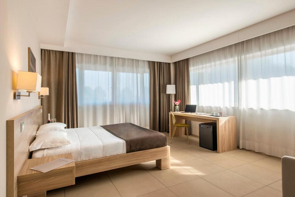 Кровать или кровати в номере Hotel Dimorae Rooms and Suites - Apartments