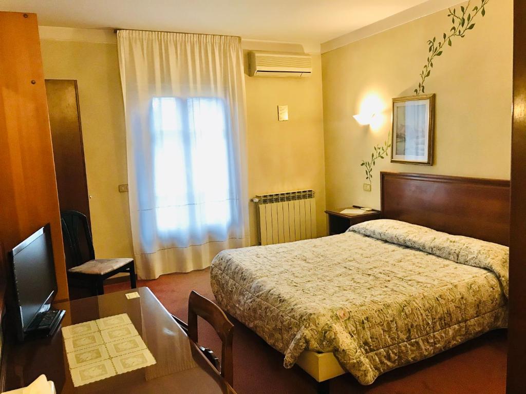Postel nebo postele na pokoji v ubytování B&B Franceschi