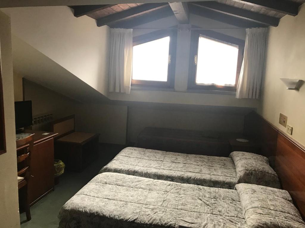 Postel nebo postele na pokoji v ubytování B&B Franceschi