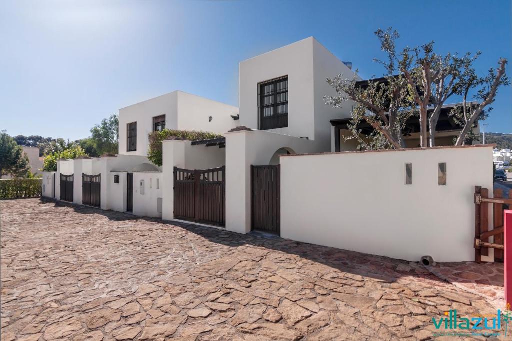 a row of white houses on a stone road at Caballo de Mar Frison Cabo de Gata in San José