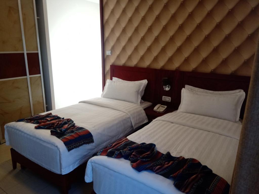 Voodi või voodid majutusasutuse seven7days hotel toas