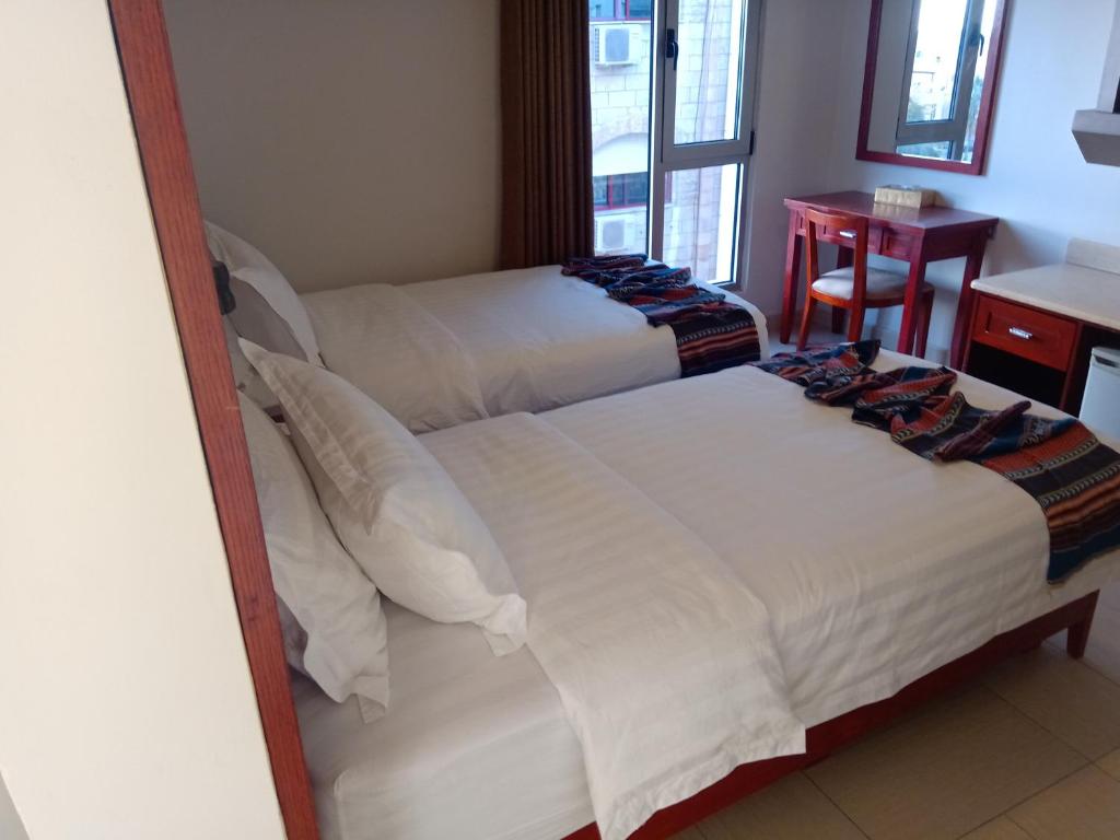 Voodi või voodid majutusasutuse seven7days hotel toas