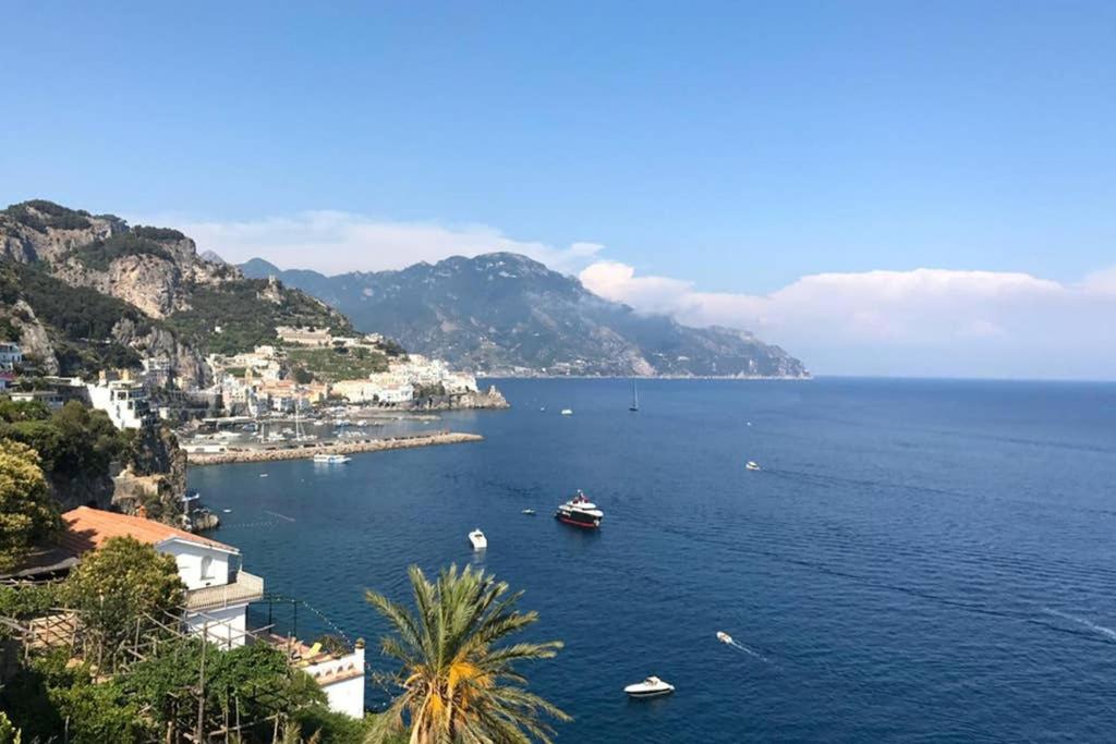 a view of a large body of water with boats at Luxury Apartment Amalfi in Amalfi