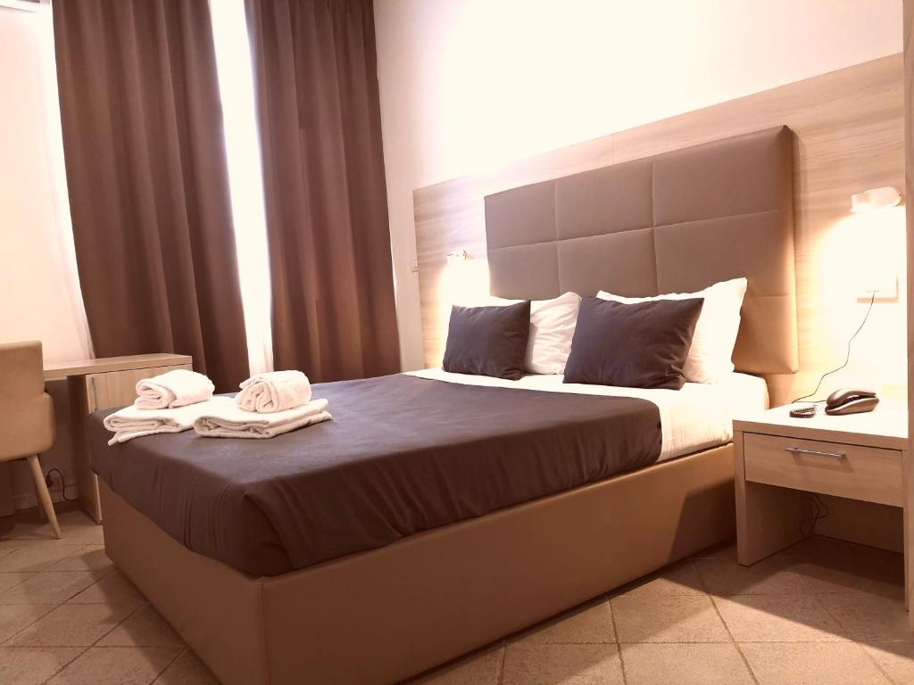 Letto o letti in una camera di Academy Hotel
