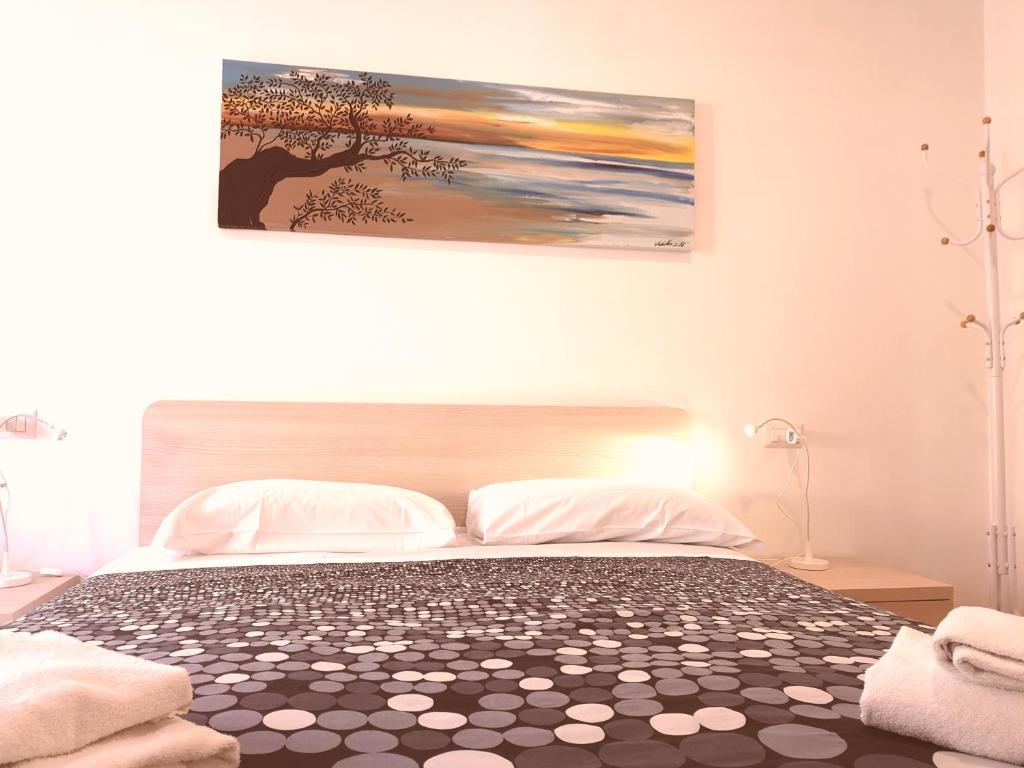 Letto o letti in una camera di Academy Hotel