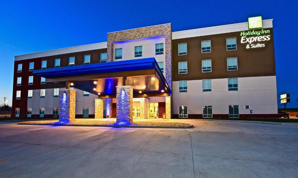 a hotel building with a lobby with blue lights at Holiday Inn Express & Suites - Perryville I-55, an IHG Hotel in Perryville