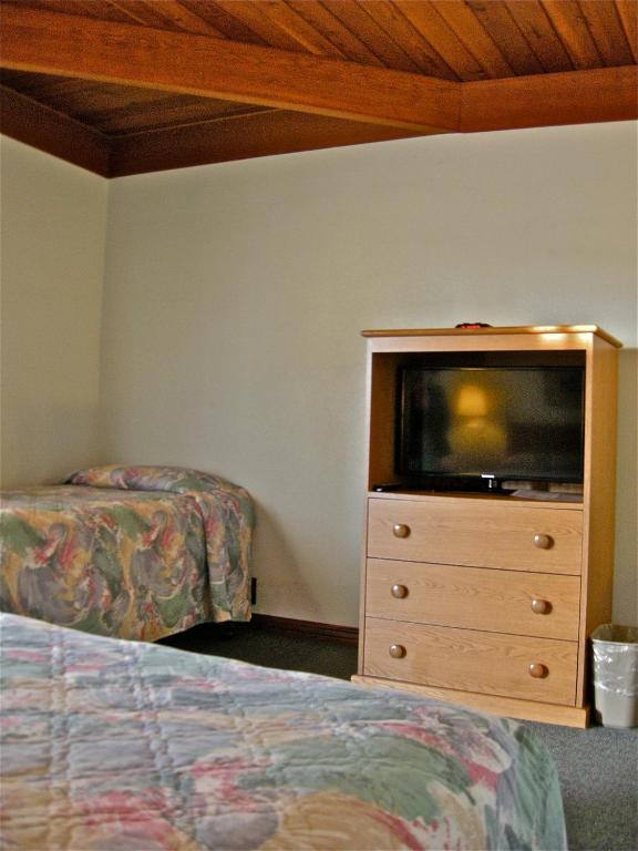 Postel nebo postele na pokoji v ubytování Azalea Lodge