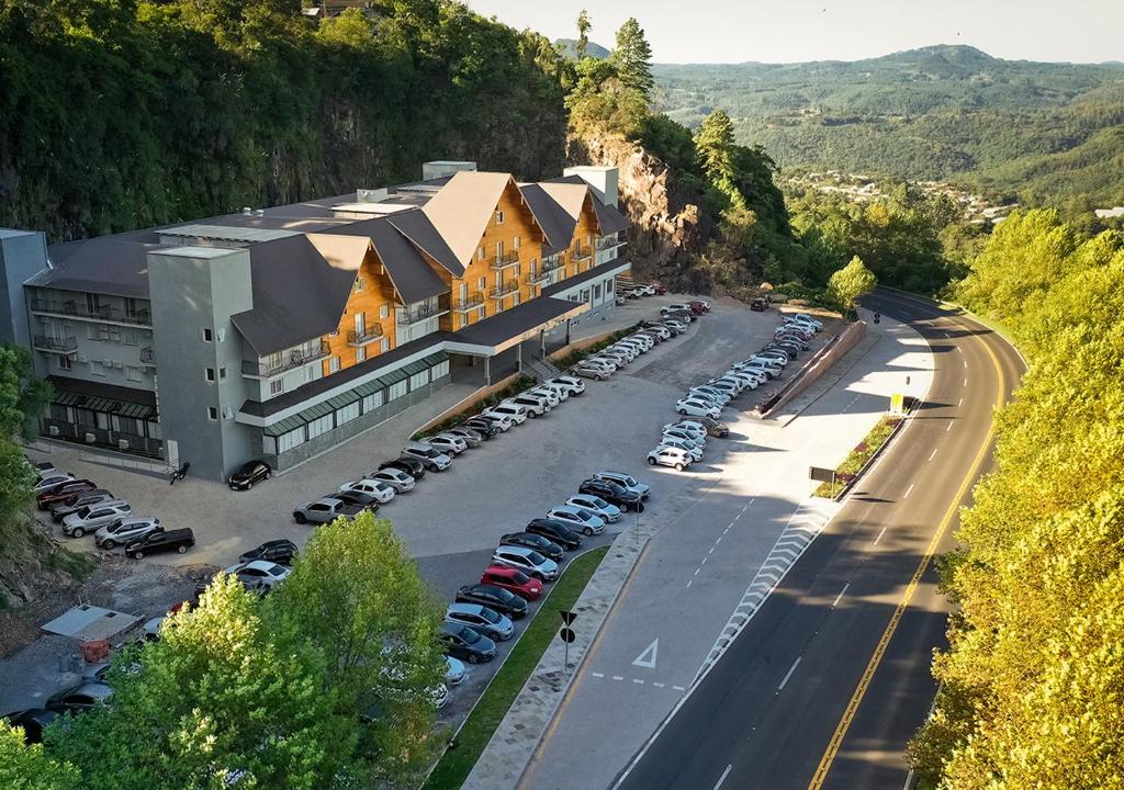 an aerial view of a building with a parking lot at Sky Palace Hotel in Gramado