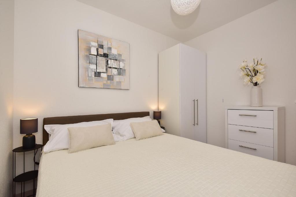 Postel nebo postele na pokoji v ubytování Apartman Luka