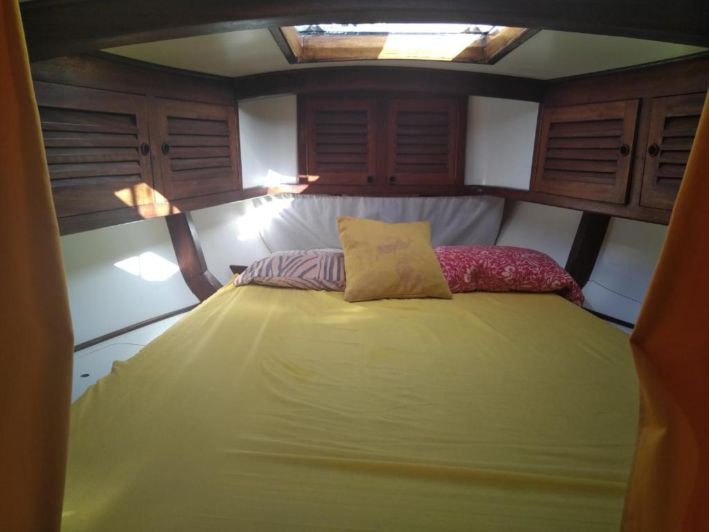 a bed in the back of a small boat at Rêve d'antilles in Les Anses-dʼArlets