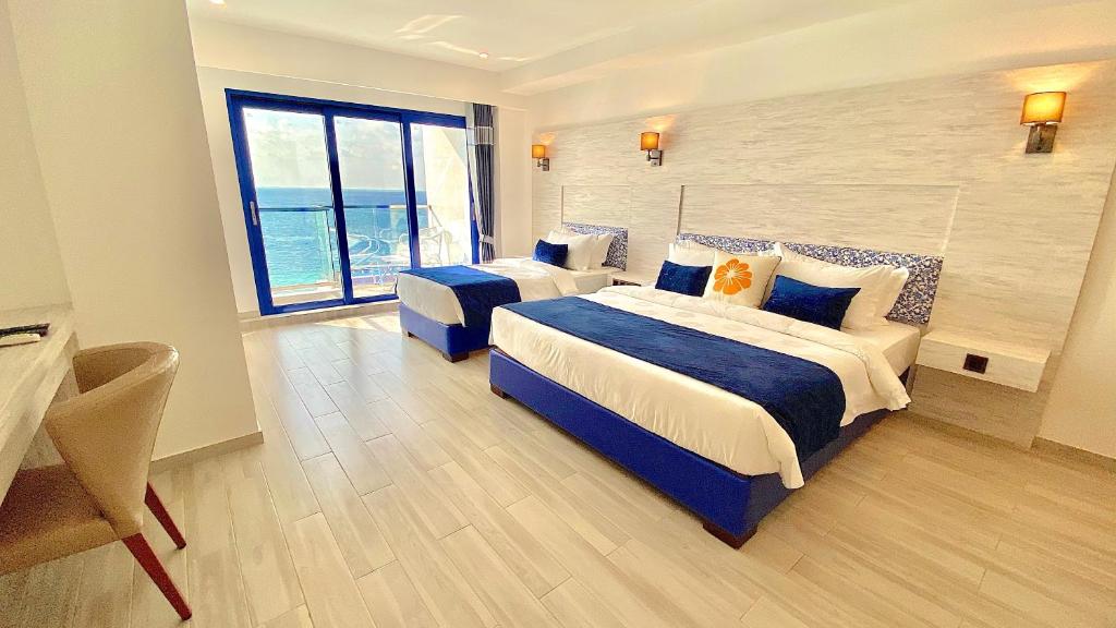 Postel nebo postele na pokoji v ubytování Kaani Palm Beach