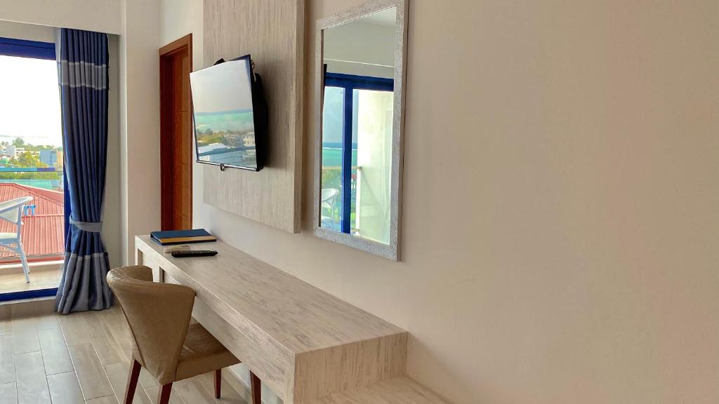 TV a/nebo společenská místnost v ubytování Kaani Palm Beach
