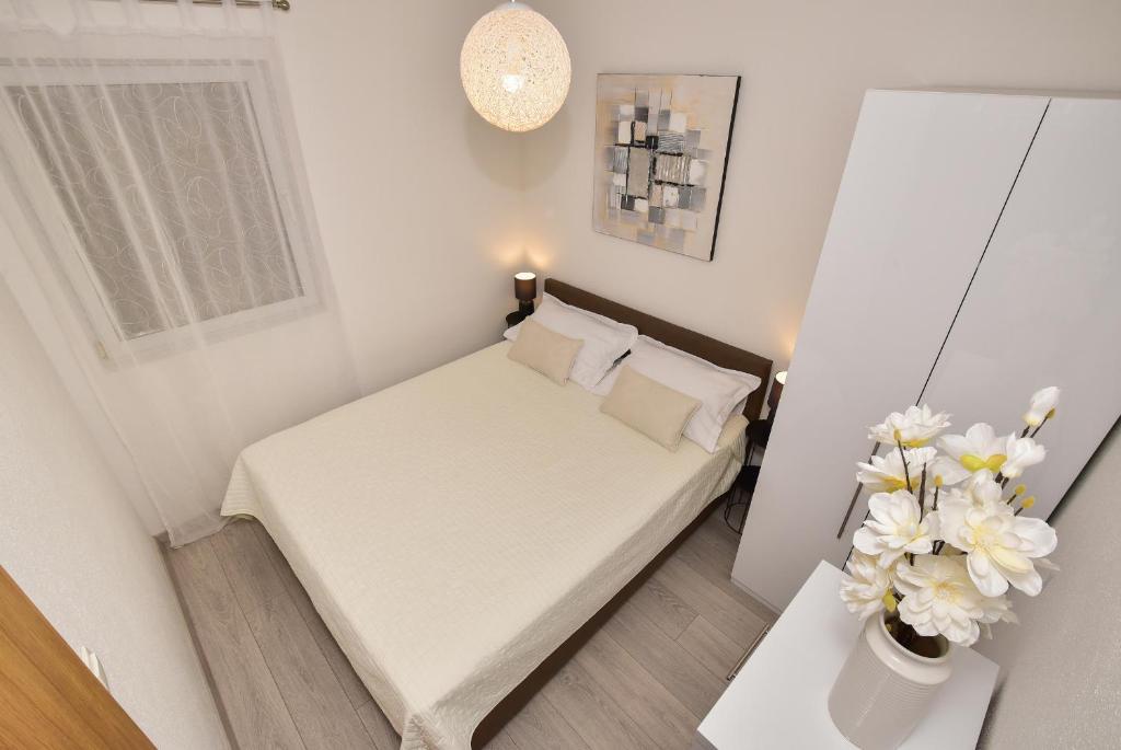 Postel nebo postele na pokoji v ubytování Apartman Luka