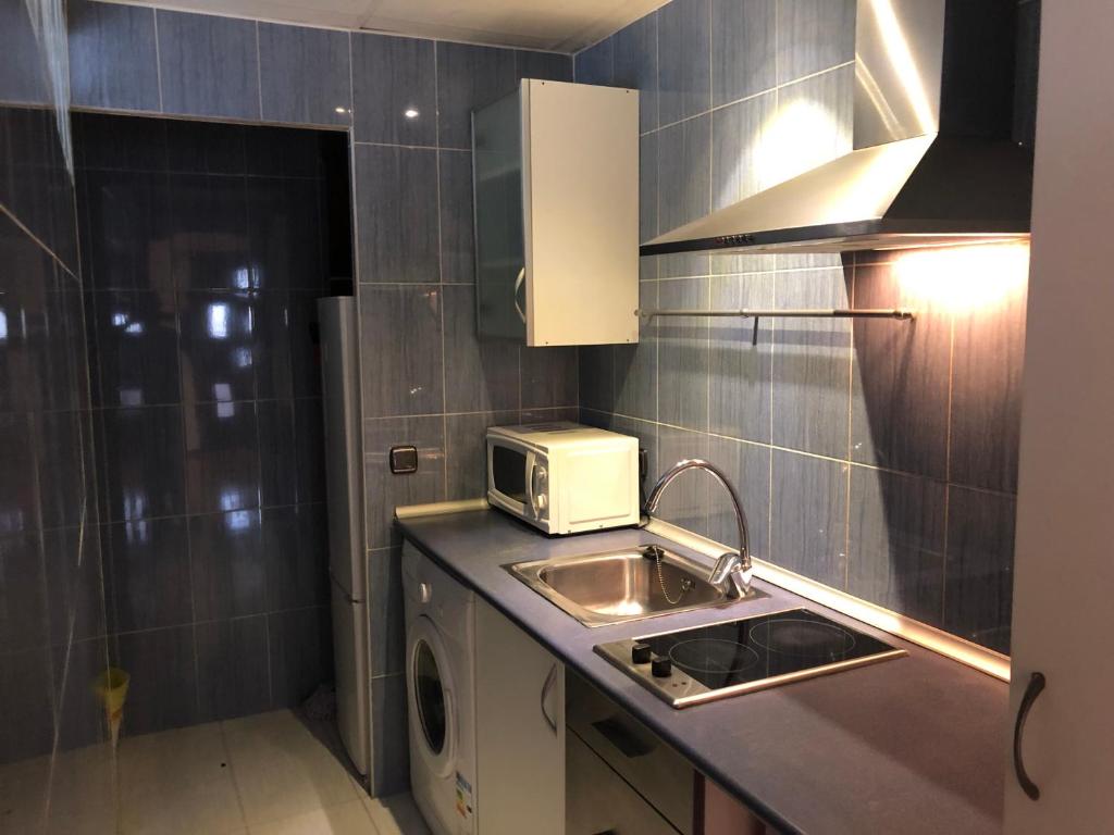 Kuchyňa alebo kuchynka v ubytovaní Apartamento Gran Comedias