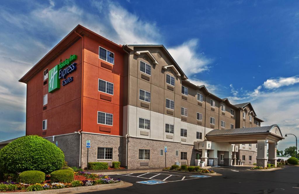 a hotel with a sign on the side of a building at Holiday Inn Express Hotel and Suites Jenks, an IHG Hotel in Jenks