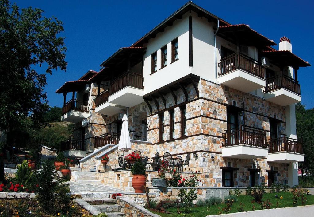 a building with balconies on the side of it at Petrini Gonia in Livadero