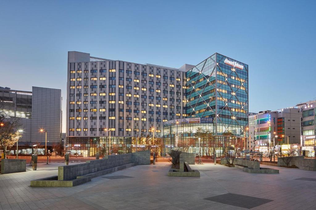 a large building with many windows in a city at Howard Johnson by Wyndham Incheon Airport in Incheon