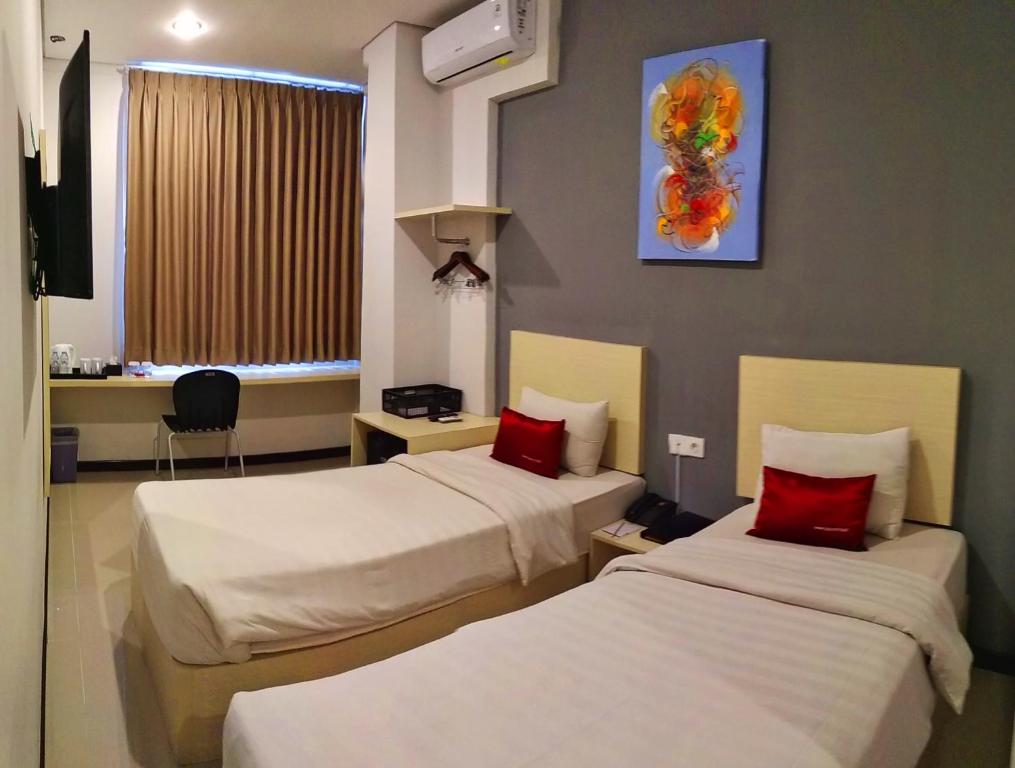 Postel nebo postele na pokoji v ubytování Valore Hotel