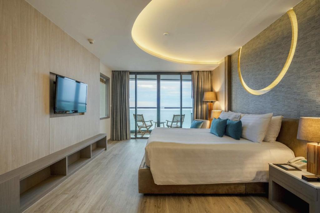 Postel nebo postele na pokoji v ubytování Cape Dara Resort