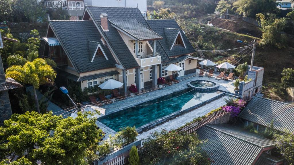 an aerial view of a house with a swimming pool at Zen Valley Dalat in Da Lat