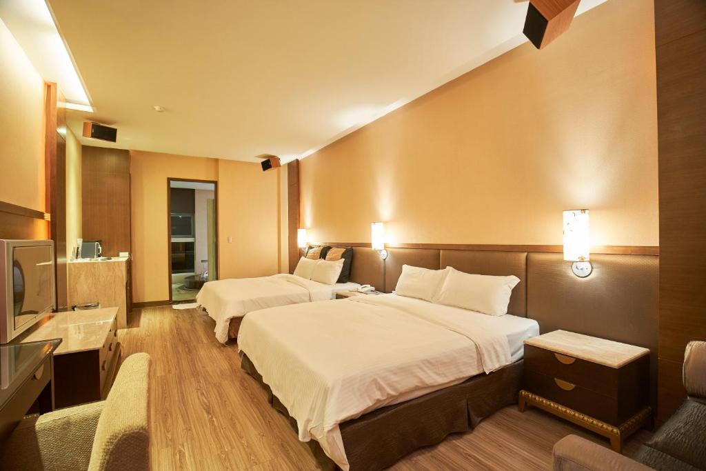 Postel nebo postele na pokoji v ubytování Dongfeng Motel