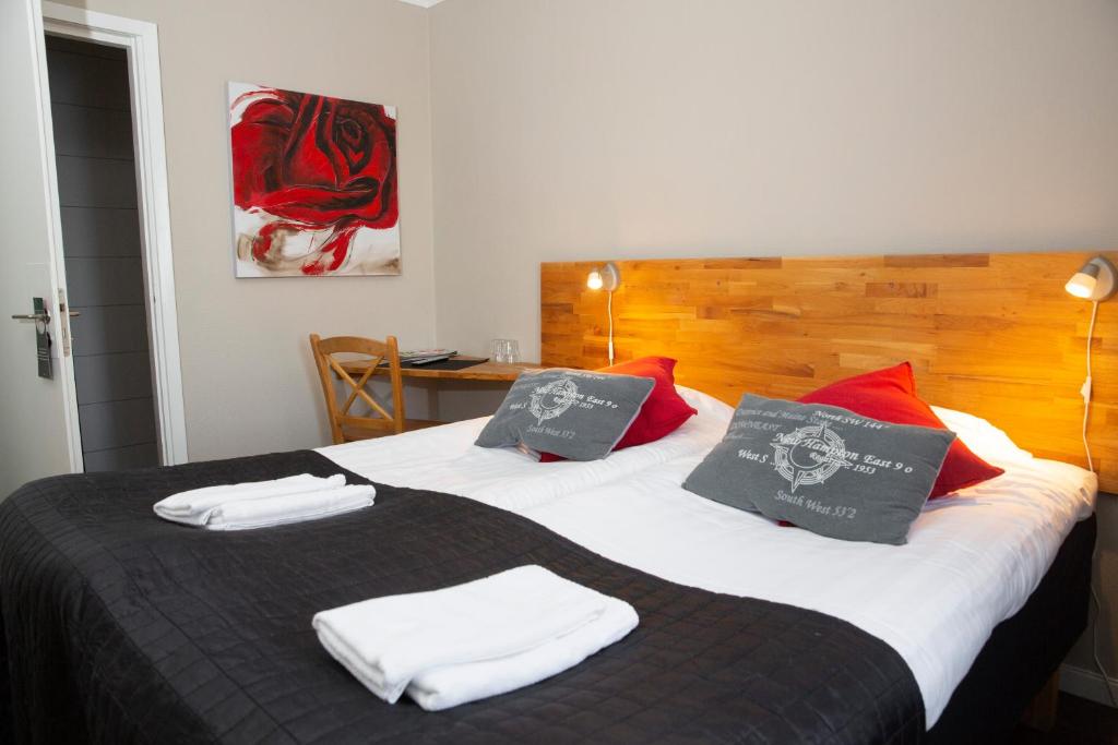 Postel nebo postele na pokoji v ubytování Hotell Veckefjärden