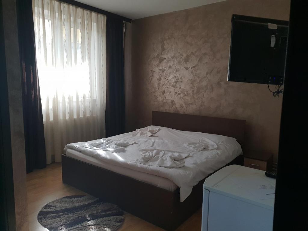 Postel nebo postele na pokoji v ubytování Villa George