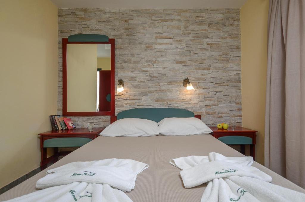 Postel nebo postele na pokoji v ubytování Hotel Naxos Beach