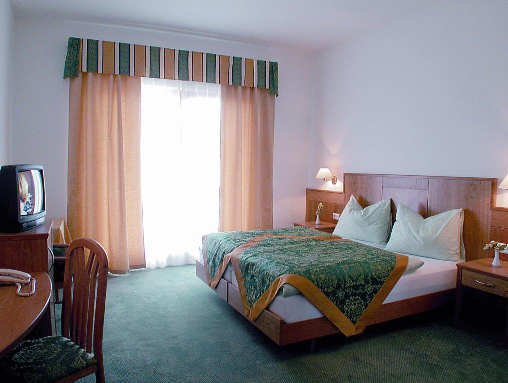 Postel nebo postele na pokoji v ubytování Gardenhotel Premstaller