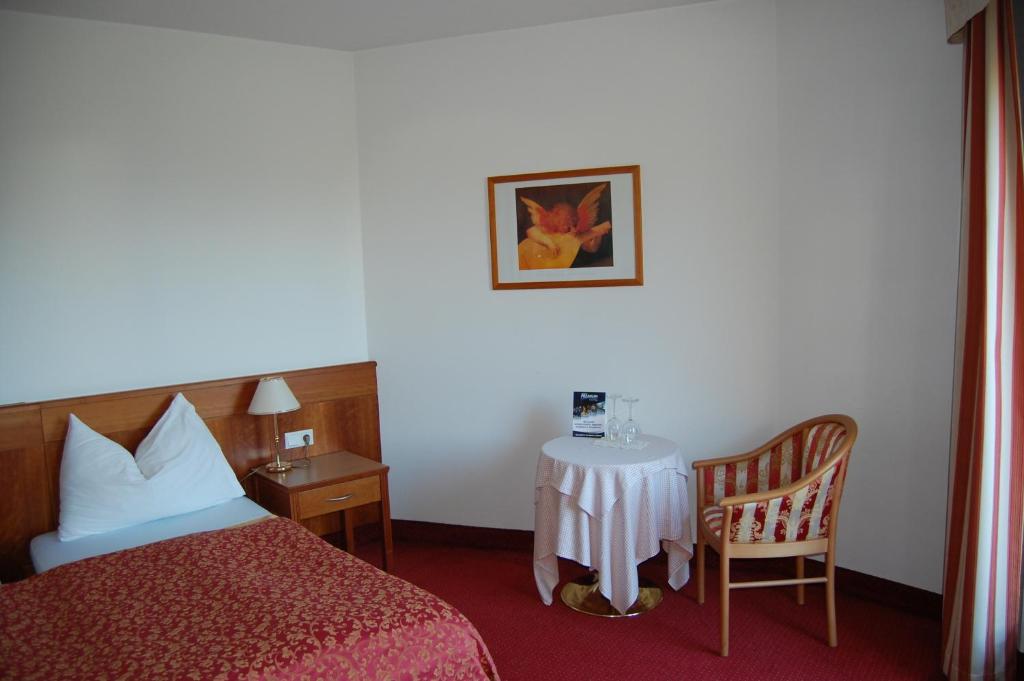 Postel nebo postele na pokoji v ubytování Gardenhotel Premstaller