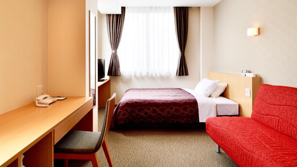 Postel nebo postele na pokoji v ubytování HOTEL SOSHA
