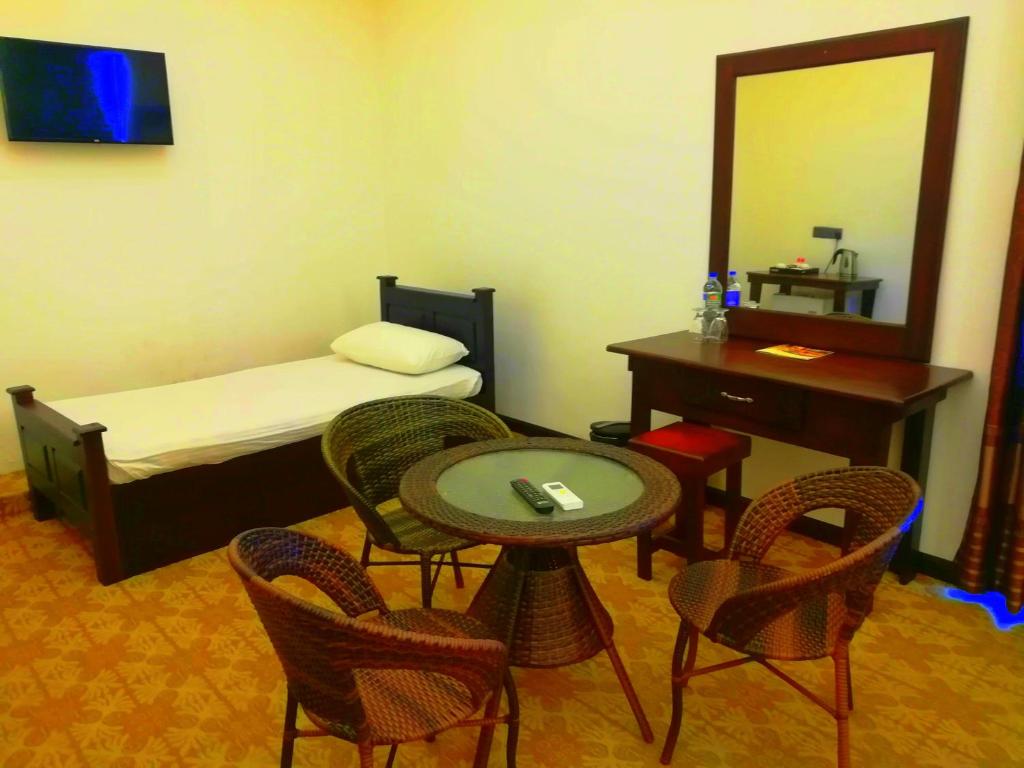 Postel nebo postele na pokoji v ubytování Euro Star Hotel