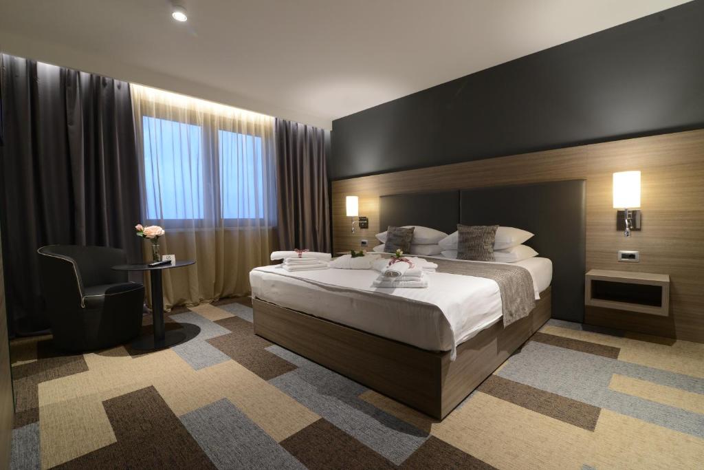 Postel nebo postele na pokoji v ubytování Hotel Princess