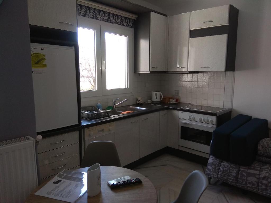 A kitchen or kitchenette at Villa Agnanti Apts and Suites