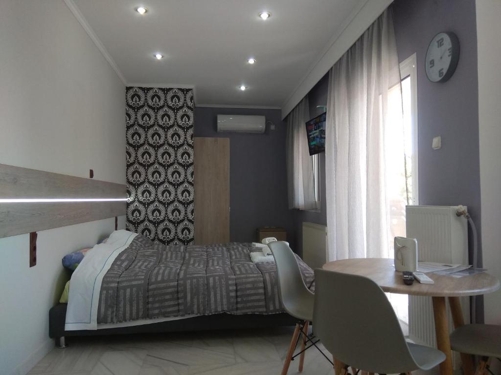 A bed or beds in a room at Villa Agnanti Apts and Suites