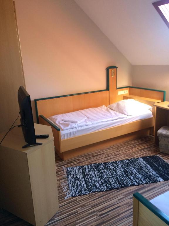 Postel nebo postele na pokoji v ubytování Vénusz Panzió és Vendéglő