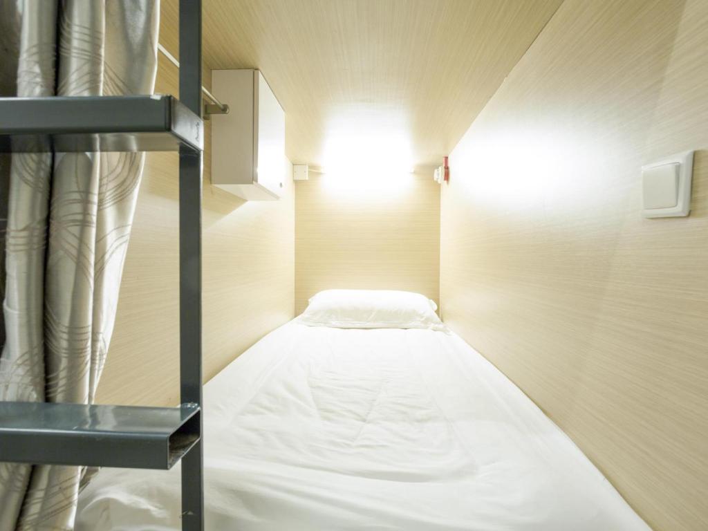 Postel nebo postele na pokoji v ubytování K2 Guesthouse Central